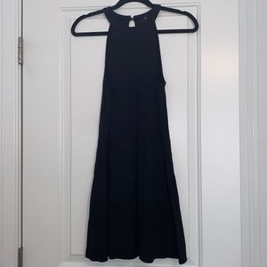Black high neck sleeveless dress.